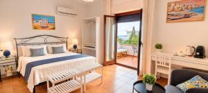 a bedroom with a bed and a balcony at Stella Marina Sea & Sun in Cefalù