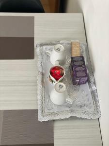 a table with a tray with two tea cups on it at Le camere del Baldo parcheggio gratuito in centro storico in Peschiera del Garda