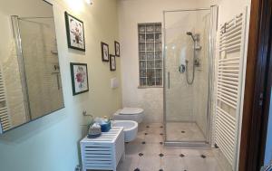 a bathroom with a shower and a toilet and a sink at Casa degli Angeli in Fermo +6 photos