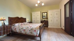 a bedroom with a bed and a dresser and a mirror at Casa degli Angeli in Fermo