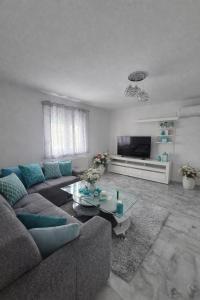 a living room with a couch and a coffee table at Plitvice Harmony one - seven person in Smoljanac