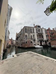 a view of a canal in a city with buildings at Casa delle gondole in Venice