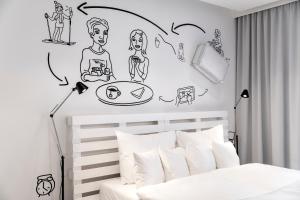 Giường trong phòng chung tại Pytloun Imperial Design Suites