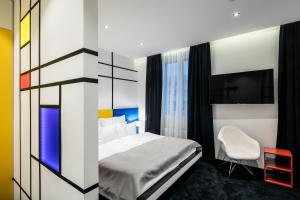 Giường trong phòng chung tại Pytloun Imperial Design Suites