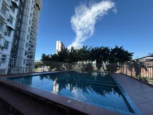 a swimming pool on the side of a building at SPICE Skyview Luxe Tunas 3B2B in Relau