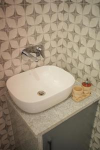 a white sink on a counter in a bathroom at Sanobar Home Stay in Bhīm Tāl