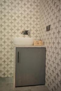a bathroom with a sink and a counter with a sink at Sanobar Home Stay in Bhīm Tāl +91 photos