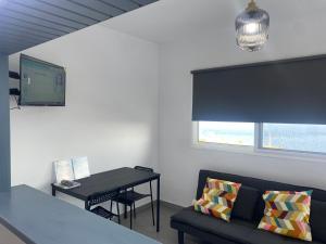 a living room with a couch and a table at Vivienda Vacacional Tinisagua 3 in Breña Alta