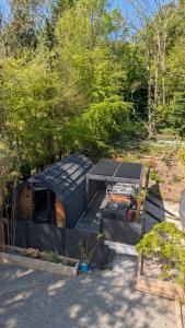 a black dome house with a table and a picnic table at Beach House Pods in Dunoon