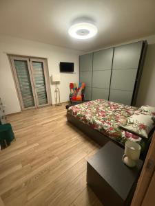 a bedroom with a bed and a table in it at Suite Vittoria in Ortona