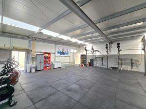 a gym with a lot of equipment in a room at Vikings AL in Areosa