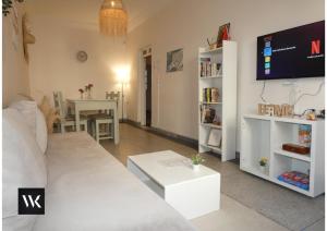 a living room with a couch and a table at WELKAM Home & Coworking in Essaouira