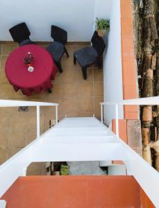 a view of a table and chairs in a room at Casa Flamenca in Granada