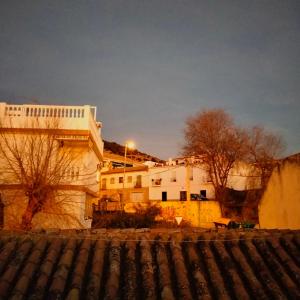 a group of buildings in a city at night at Casa Flamenca in Granada