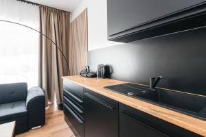a kitchen with a sink and a counter top at Villa Gall in Český Krumlov