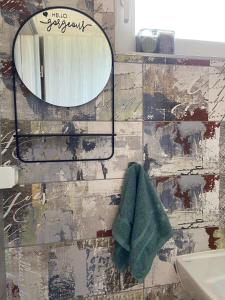 a bathroom with a mirror and a sink at Studio Angelina in Prestranek