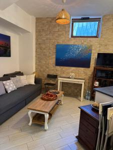 a living room with a couch and a table at La Casa di Ornella in Rome