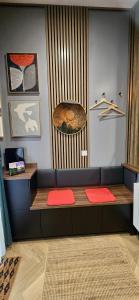 a room with a bench with red mats on it at The NOOK in Kinlochleven