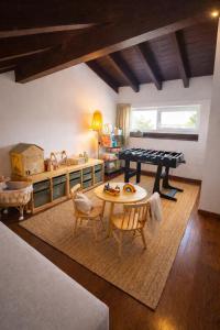 a living room with a ping pong table at Casa en Vilallobent Cerdanya ideal familias by CalQuerol in Vilallovent