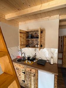 a kitchen with a sink and a counter top at Mountains story in Bistrica Lipovska +10 photos
