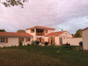 a house with a yard in front of it at St Pasha in Paillé