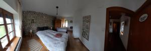 a bedroom with a bed in a room at le Gîte de Marie Ray Sur Saône in Ray-sur-Saône