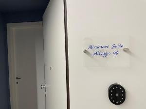 an office door with an independence shuttle sign on it at Hotel Miramare in Savona +32 photos