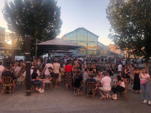 a large crowd of people sitting in chairs at tables at Villa d Architecte Moderne spa et piscine in Niort