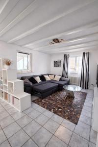 a living room with a couch and a table at Ferienwohnung Wald-Michelbach in Wald-Michelbach