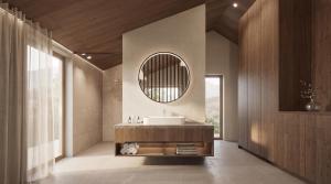 a bathroom with a sink and a mirror at AMIL chalets dolomites - Guests aged 14 and over in Arnbach