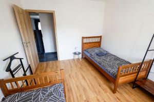 a bedroom with a bed and a staircase in a room at Villa de Calma Samorin in Šamorín