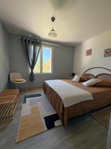a bedroom with two beds and a window at Mon calme in Arques-la-Bataille