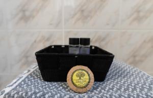 a small black box with a wooden holder on a table at Hotel Koutriaris in Distomo