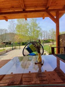 a chair sitting on a table under a pavilion at Unska Bajka Bihać in Bihać