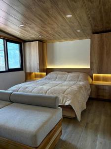 a bedroom with a large bed in a room at Welcome to our home in Beirut
