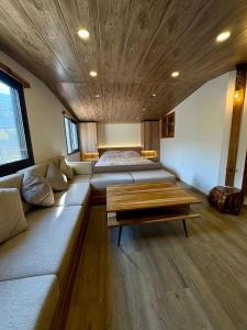 a living room with a couch and a table at Welcome to our home in Beirut