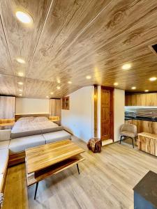 a bedroom with a bed and a wooden ceiling at Welcome to our home in Beirut