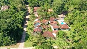an aerial view of a resort in the jungle at Pousada Porto Aventura - Chalés da Luci -Guaraú 13-98159-2115 in Peruíbe