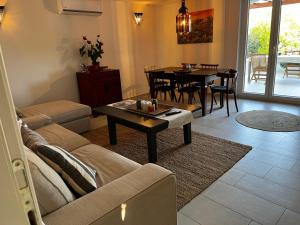 a living room with a couch and a table at El Dorado in Premantura