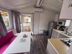 a small kitchen with a white counter in a room at Schilke24 - A017 in Boofzheim +11 photos