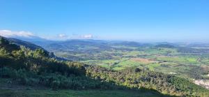 a view of a valley with trees and mountains at Casa Los Soles in El Bosque +8 photos