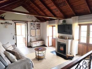 a living room with a couch and a fireplace at Casa Julián in Garafía