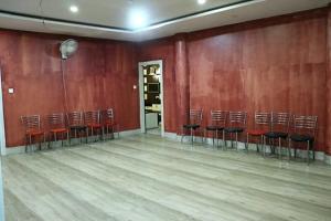 an empty room with a bunch of chairs in it at Harsh-Regency in Rānchī