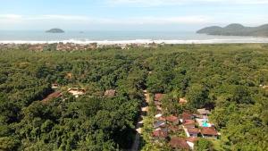 an aerial view of a house in a forest at Pousada Porto Aventura - Chalés da Luci -Guaraú 13-98159-2115 in Peruíbe
