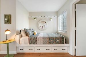 a bedroom with a bed and a mirror at Above the Trees - Modern Studio for 2 with Views, Wifi, Pools in Gatlinburg