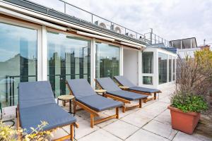 a row of chairs sitting on a balcony at Sky Garden Vienna in Vienna
