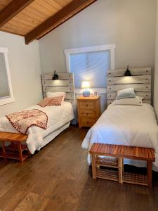 a bedroom with two beds and a window at The Riptide Retreat in Shelton