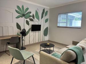 a living room with a couch and a table at Prospect Cottage in Walmer