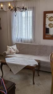 a living room with a couch and a window at Međugorje Quit Hideaway in Botići