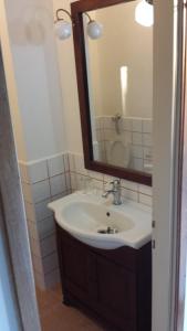 a bathroom with a sink and a mirror at Agriturismo Casal Taccone in Tarquinia